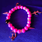 Pinkfarbener Ball mit Anhängern ・ARMREIF